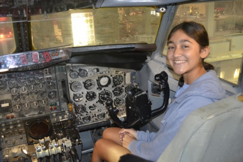 Isabella in a Jet cockpit